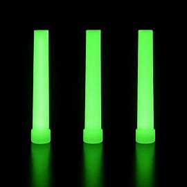 Three bright green glow sticks shining in the dark, used as 12-hour emergency lights for camping, survival gear, and blackout situations